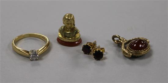 An 18ct gold and solitaire diamond ring, a 9ct gold spinning fob, a pair of 9ct gold ear studs and a gilt metal seal.